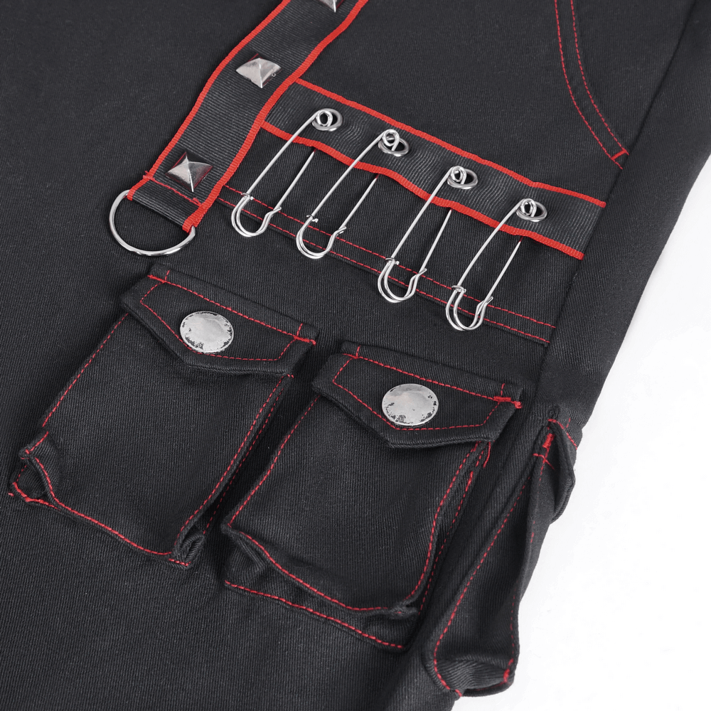 Close-up of black gothic pants featuring red stitching, metal accents, and multiple pockets for an edgy style.