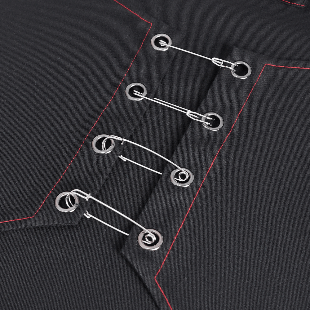 Close-up of Gothic black fabric featuring red stitching and metal accents for edgy style.