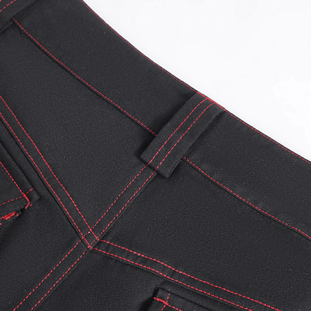 Close-up of Gothic black pants showcasing red stitching and pocket details, perfect for edgy fashion lovers.