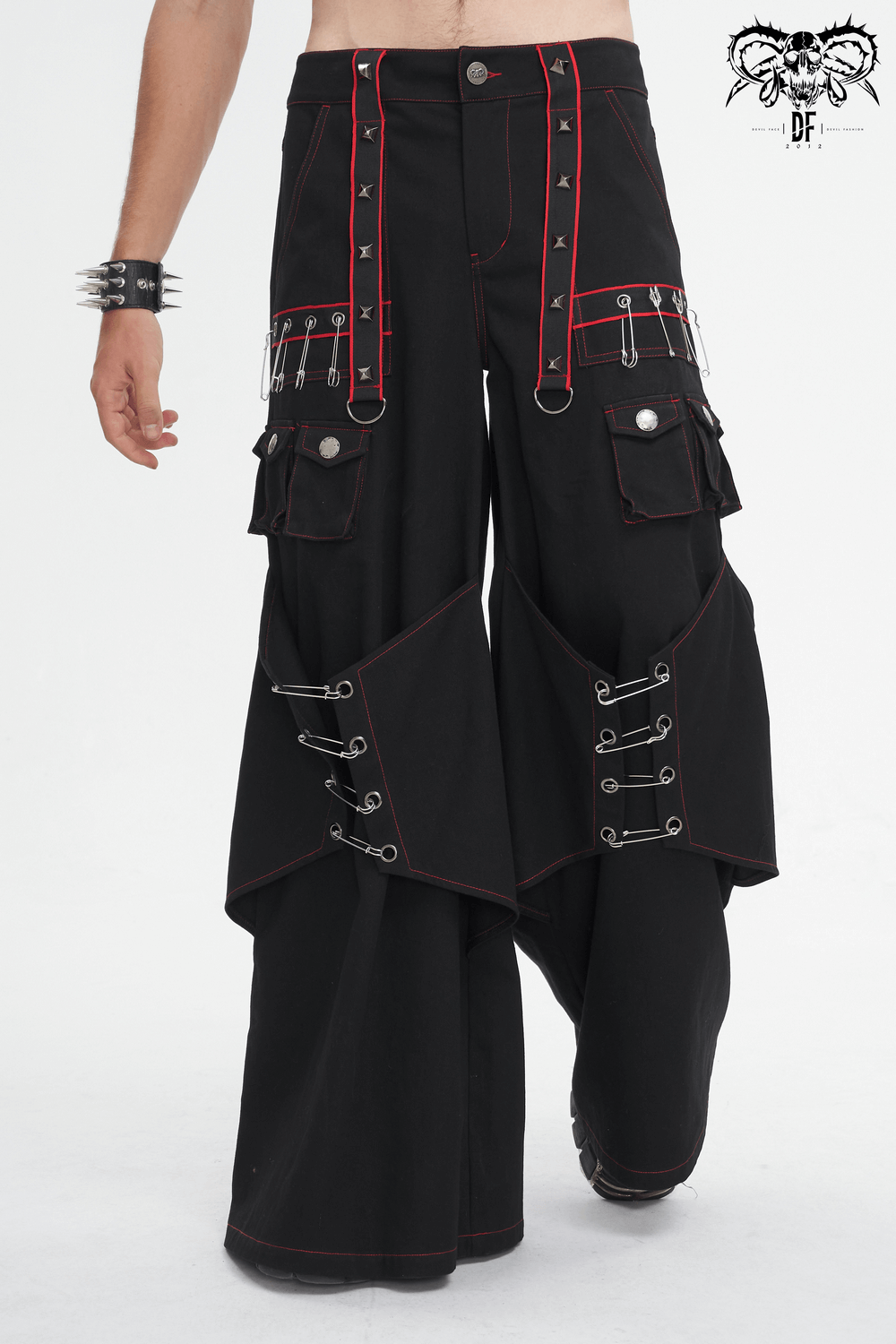 Gothic black loose pants with red stitching, metal accents, and pockets for an edgy, fashion-forward look.