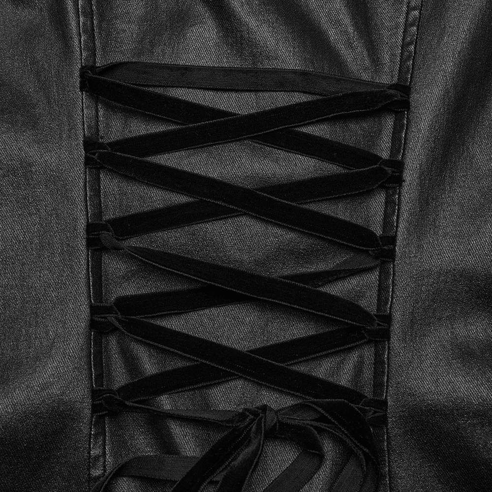 Close-up of black patent leather dress with intricate lace-up detail and drawstring design for a gothic touch.