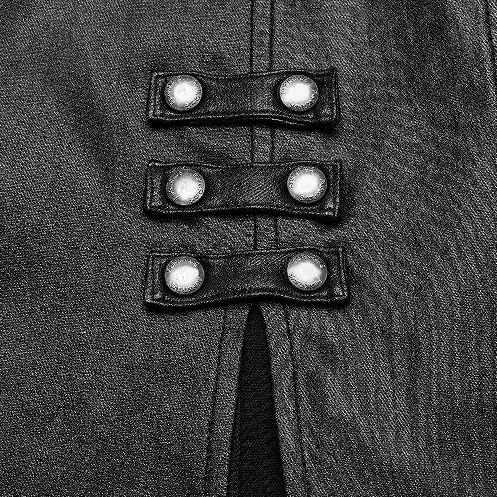 Close-up of snap buttons on a gothic black dress with a double slit and edgy design.