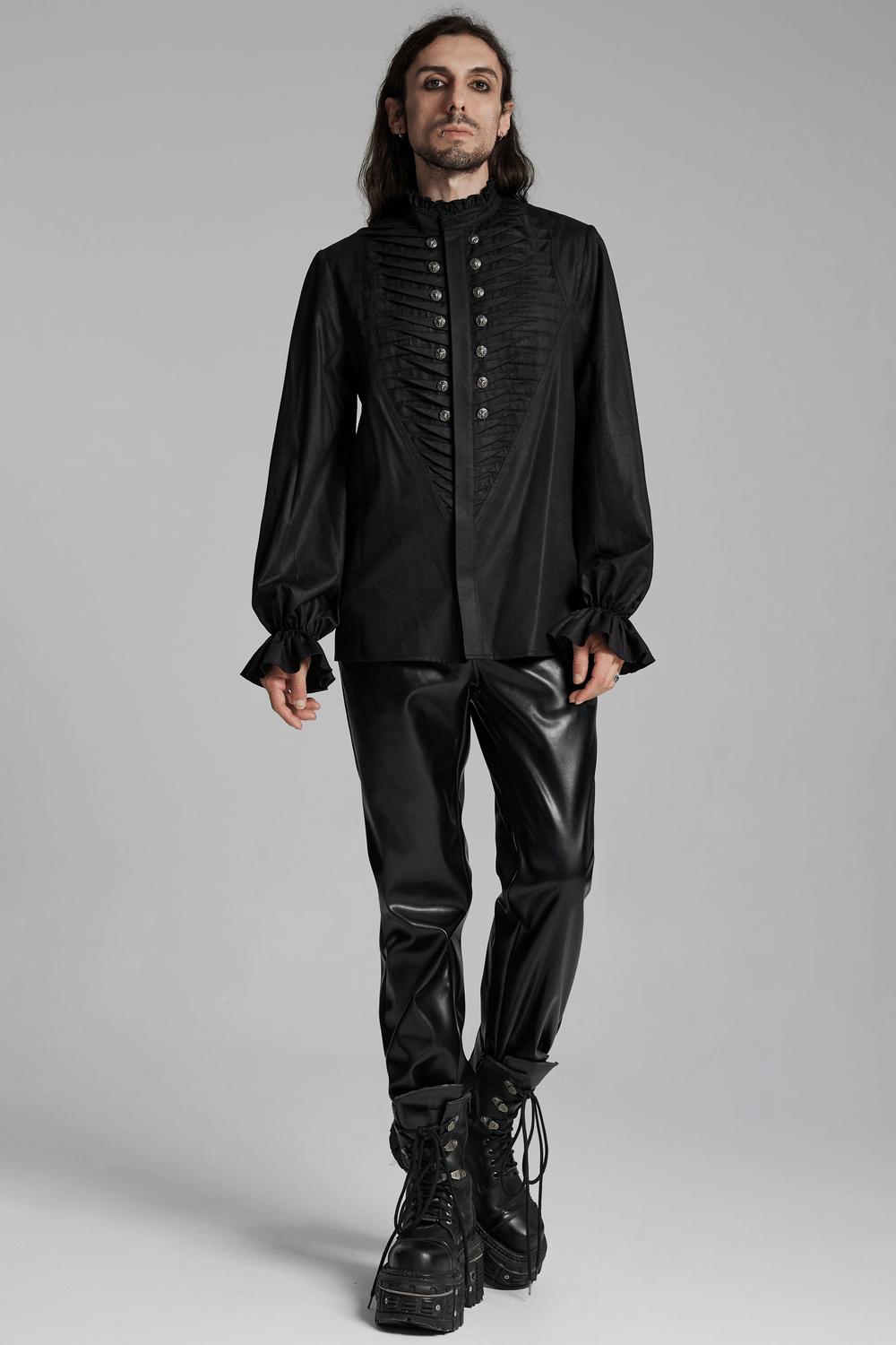 Gothic black pleated shirt with metal beast head buttons, paired with stylish leather pants and chunky boots.