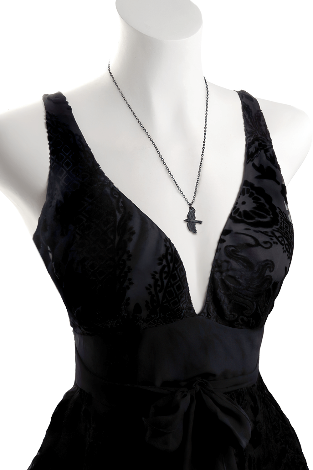 Gothic black raven pendant showcased on a stylish black dress, symbolizing Norse mythology and ancient wisdom.