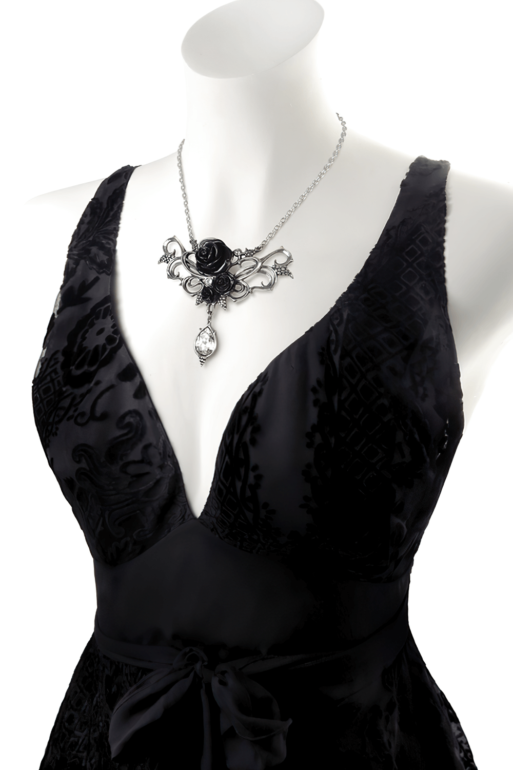 Elegant Gothic black rose necklace with teardrop crystal charm on a black dress mannequin.
