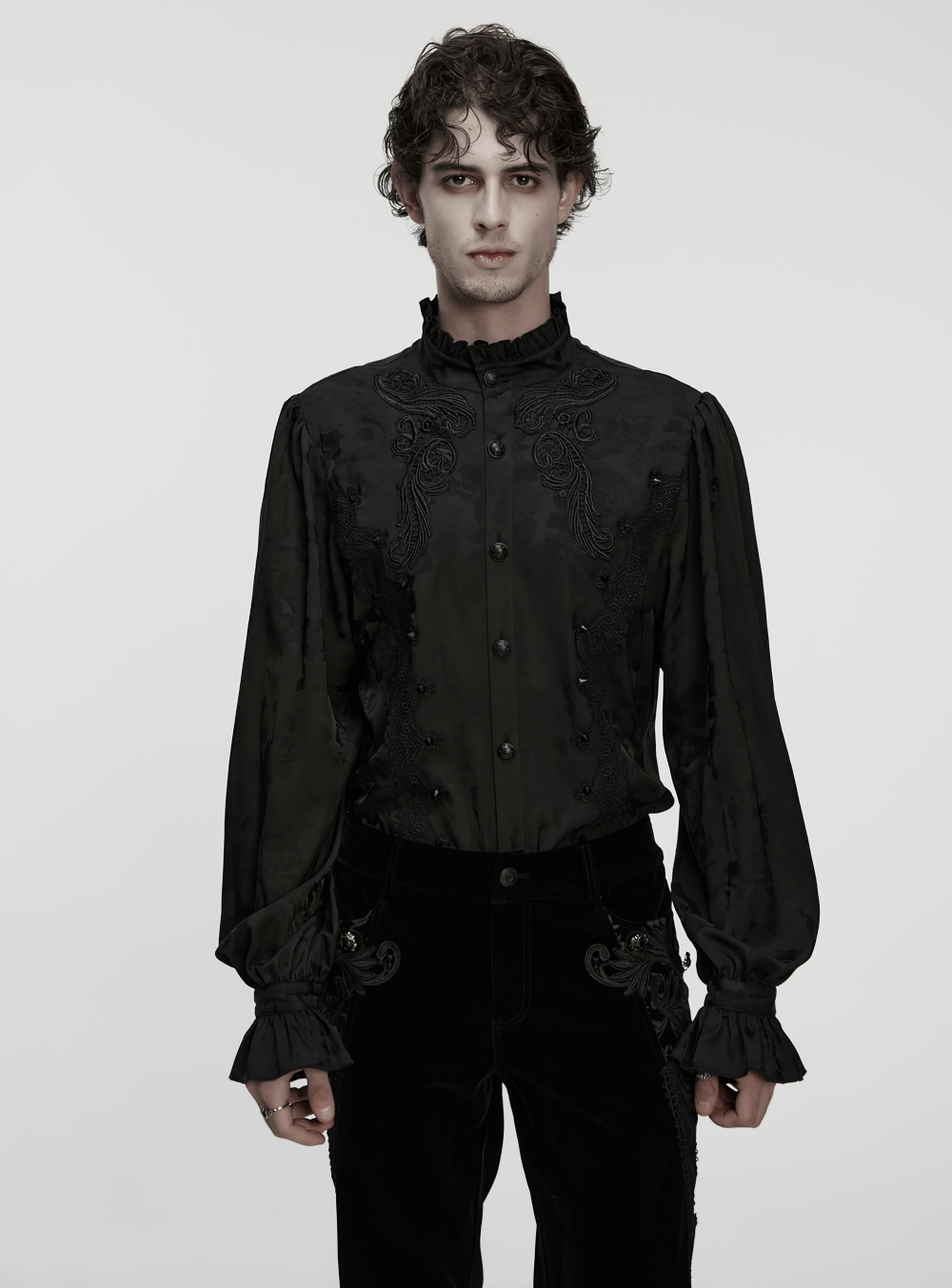 Gothic Black Ruffled Collar Embroidered Long Sleeve Shirt worn by a model with dark trousers, featuring exquisite lace details.