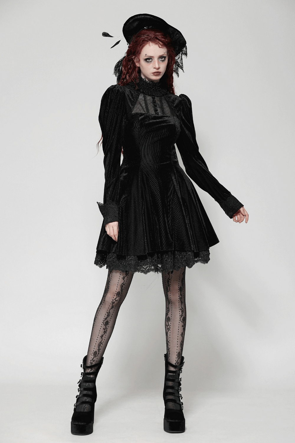 Elegant gothic black velvet dress with lace ruffles, puff sleeves, and stylish accessories for a vintage look.