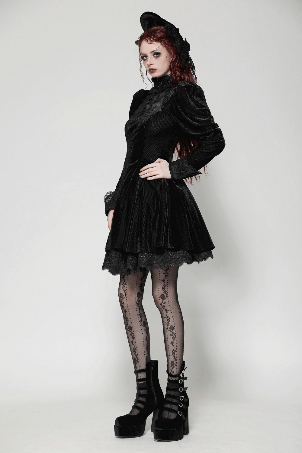 Gothic black ruffled velvet dress with lace details, puff sleeves, and stylish black platform shoes.