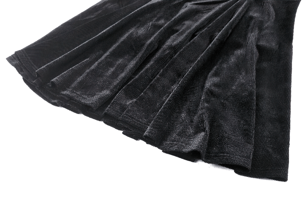 Close-up of black velvet fabric showcasing ruffled texture and elegant draping, ideal for gothic dress designs.