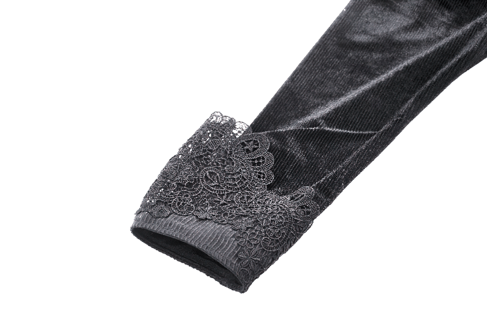 Close-up of lace detailing on the sleeve of a gothic black velvet dress, showcasing elegance and intricate design.