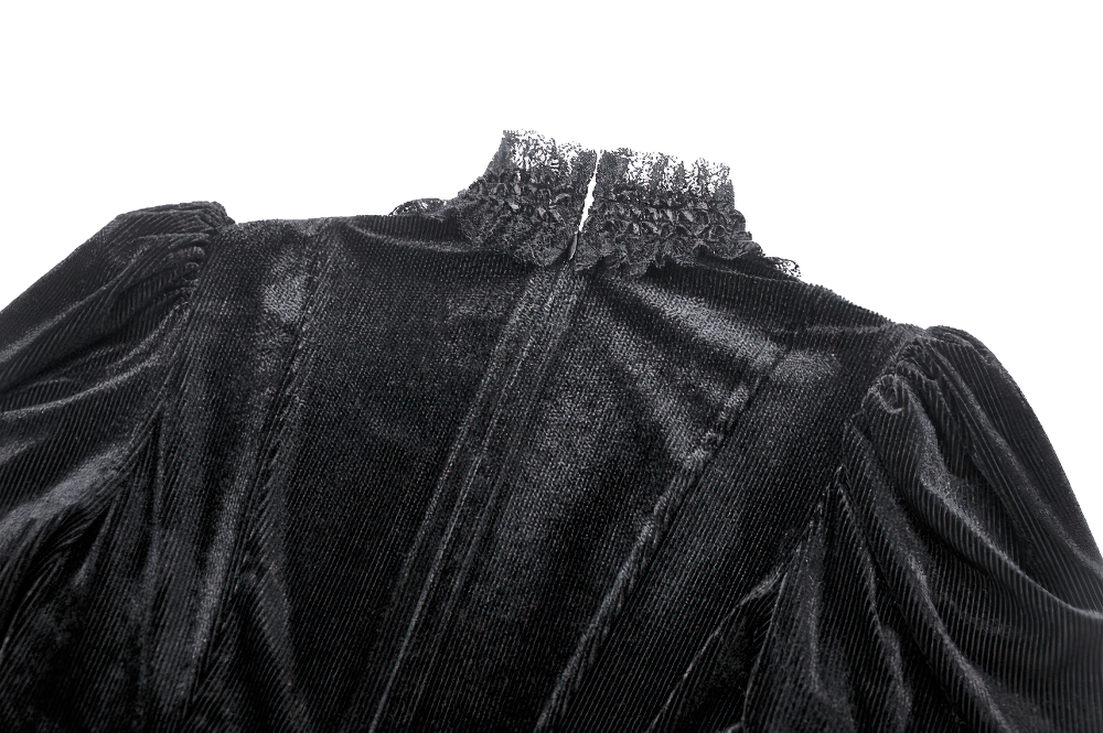 Close-up of the back of a gothic black velvet dress with lace collar and puff sleeves for an elegant vintage look.