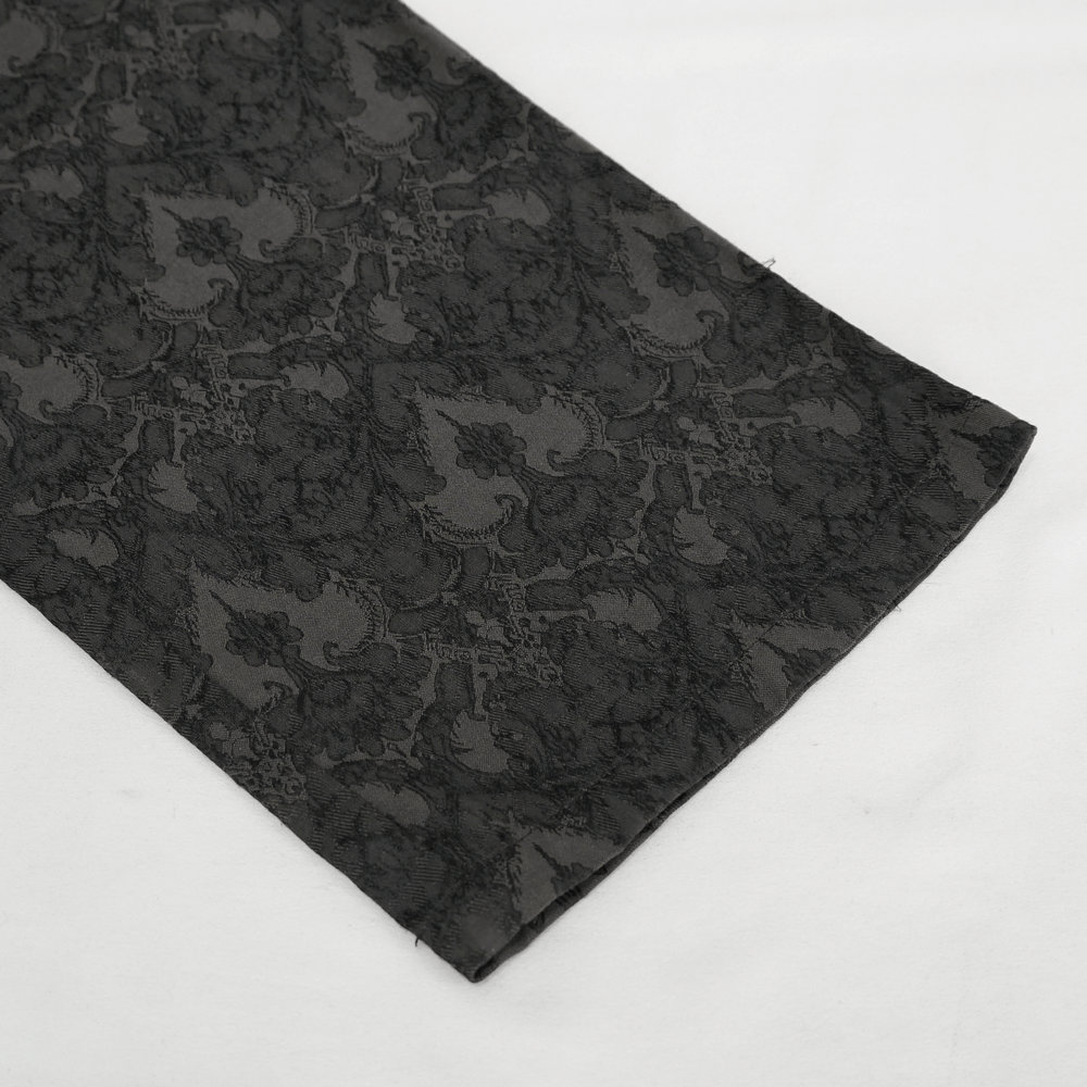 Close-up of vintage black silk fabric with intricate Gothic patterns for men's high waist trousers.