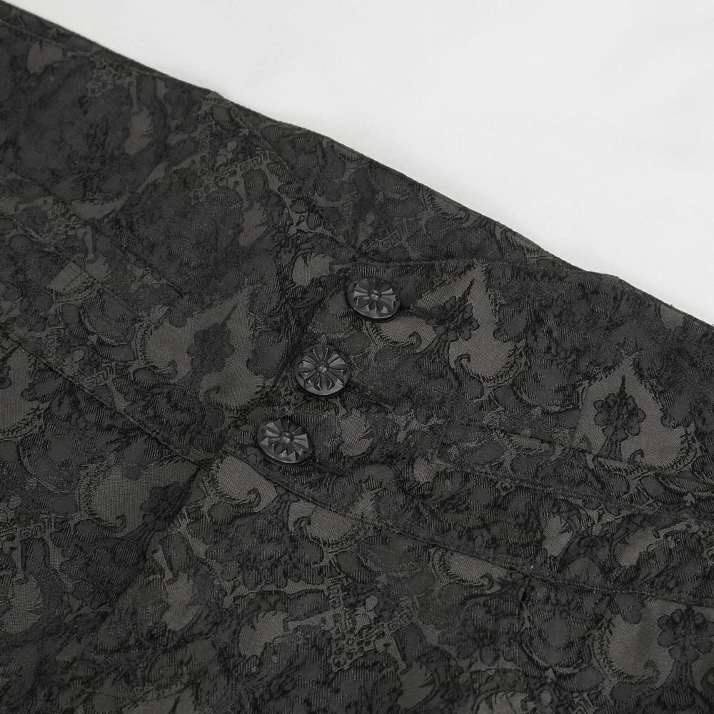Close-up of the delicate lace pattern and buttons on Gothic black silk men's trousers.