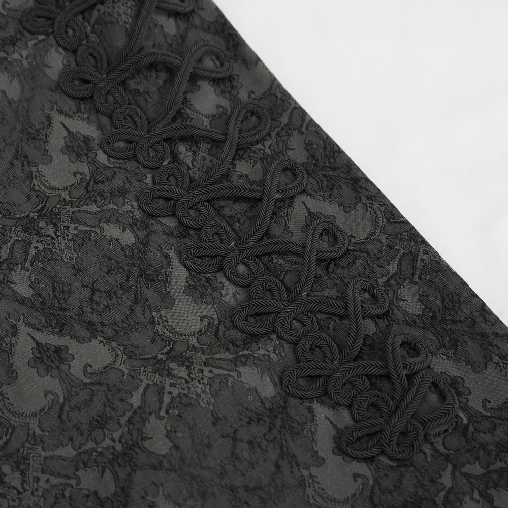 Close-up of intricate vintage black fabric pattern with elegant lace detailing for gothic fashion.