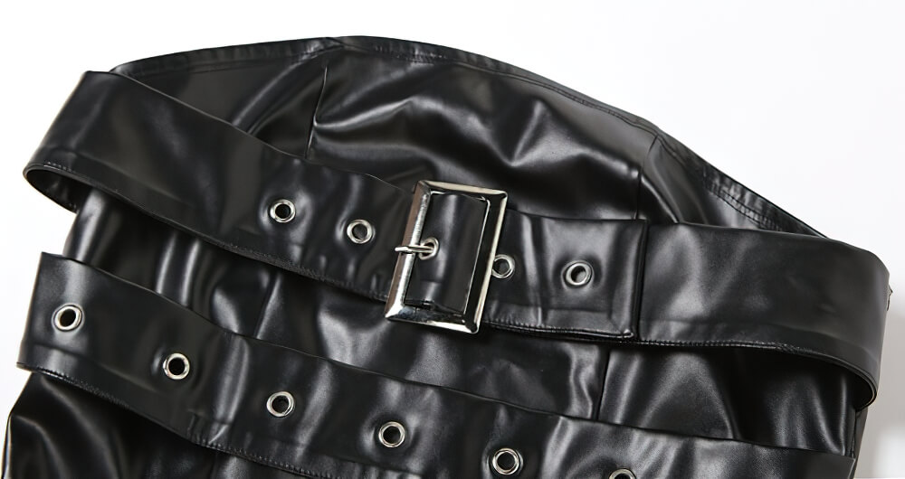 Close-up of a stylish black faux leather belt with buckle and eyelets for gothic fashion.