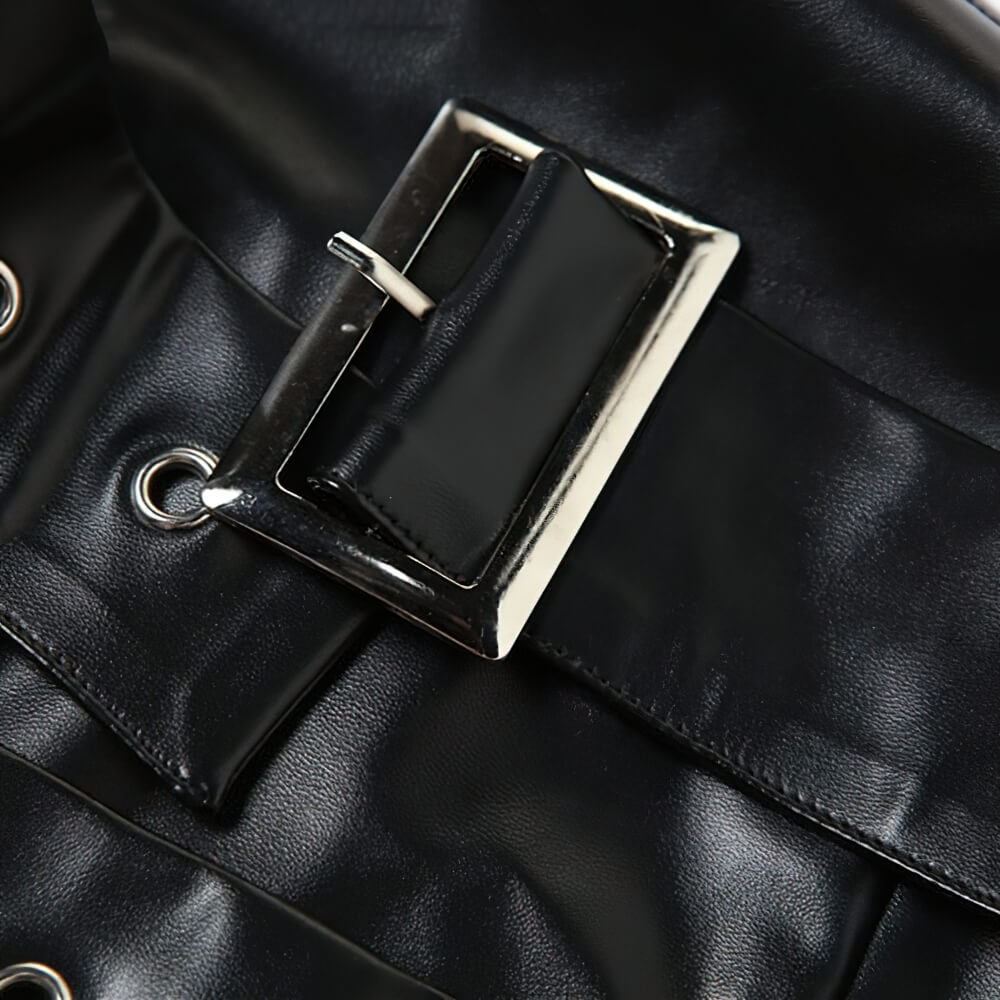 Close-up of a stylish black belt buckle on a gothic off-shoulder crop top for women, showcasing bold fashion details.