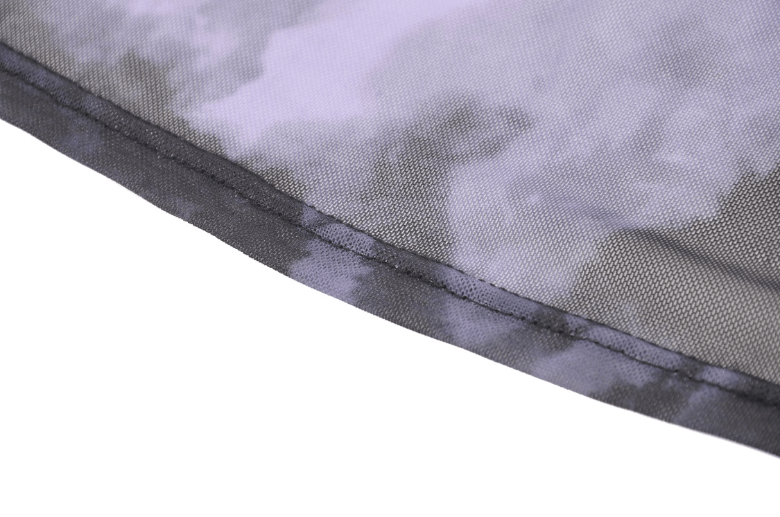 Close-up of a gothic black satin fabric with intricate lace trim, showcasing its elegant design and smooth texture.