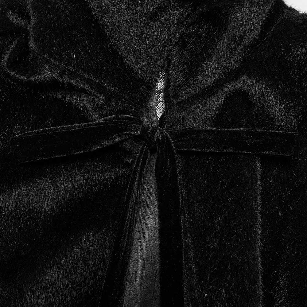 Close-up of the elegant black vampire cape with a velvet tie closure, showcasing its luxurious texture and Gothic design.