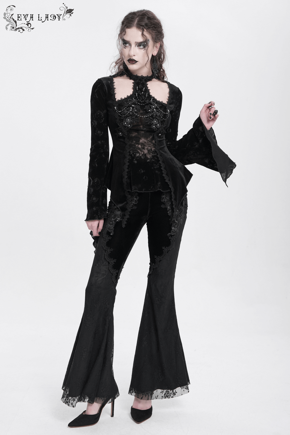 Gothic black velvet flared pants with lace hem and embroidery, perfect for a romantic Victorian aesthetic.