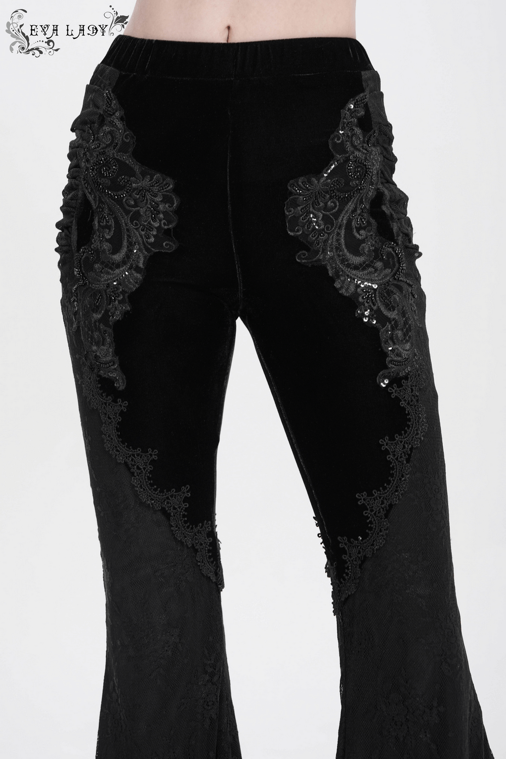 Gothic black velvet flared pants with baroque lace embroidery and dramatic bell-bottom silhouette.