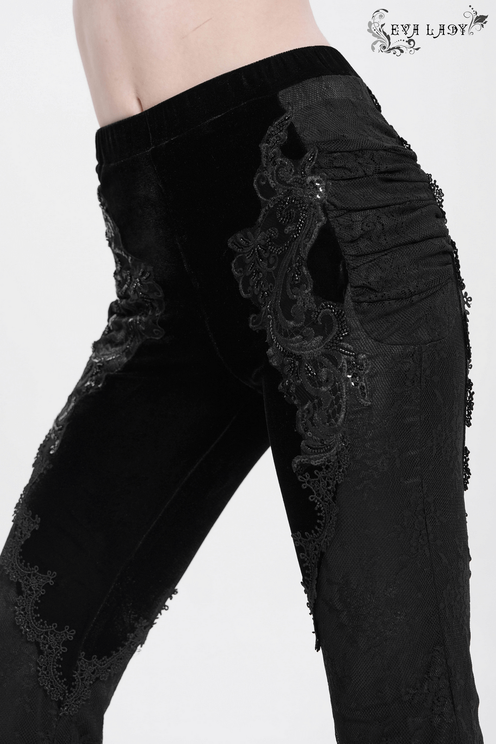 Gothic black velvet and lace flared pants with intricate embroidery and Victorian-style details.