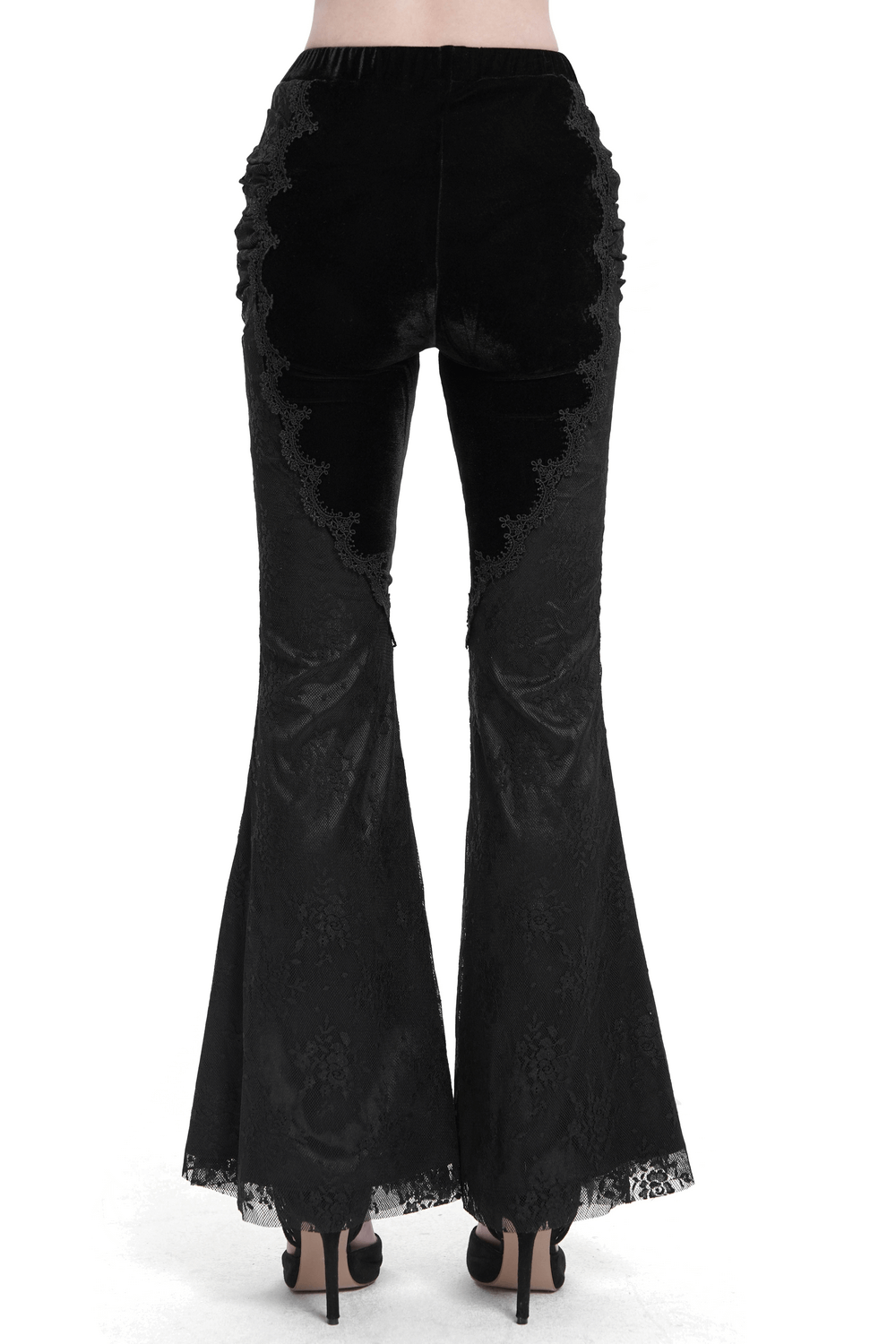 Back view of gothic black velvet flared pants featuring intricate lace details and a dramatic bell-bottom silhouette.