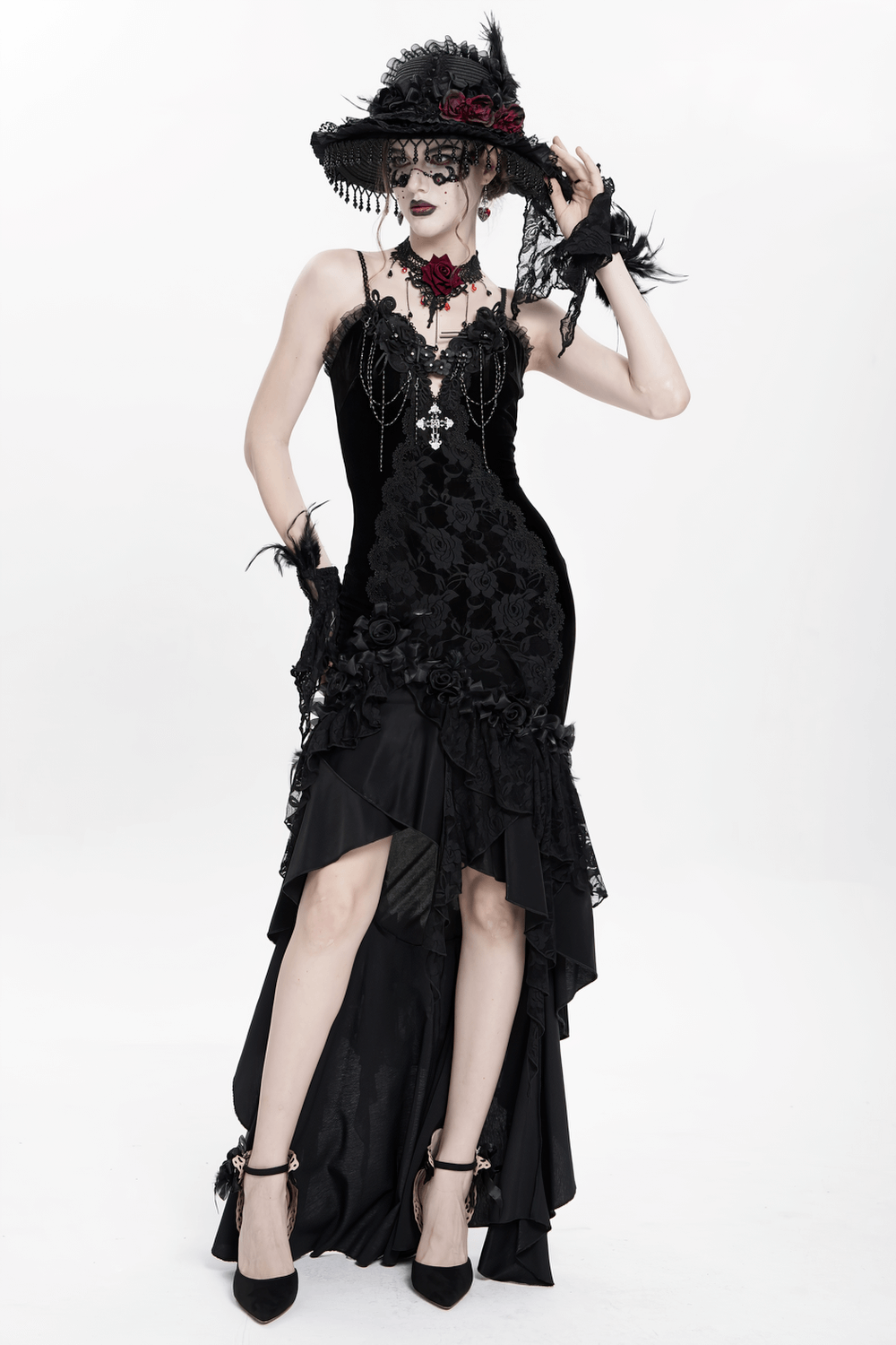 Victorian-inspired gothic black velvet and lace high-low evening dress with rose trim and dramatic ruffles.