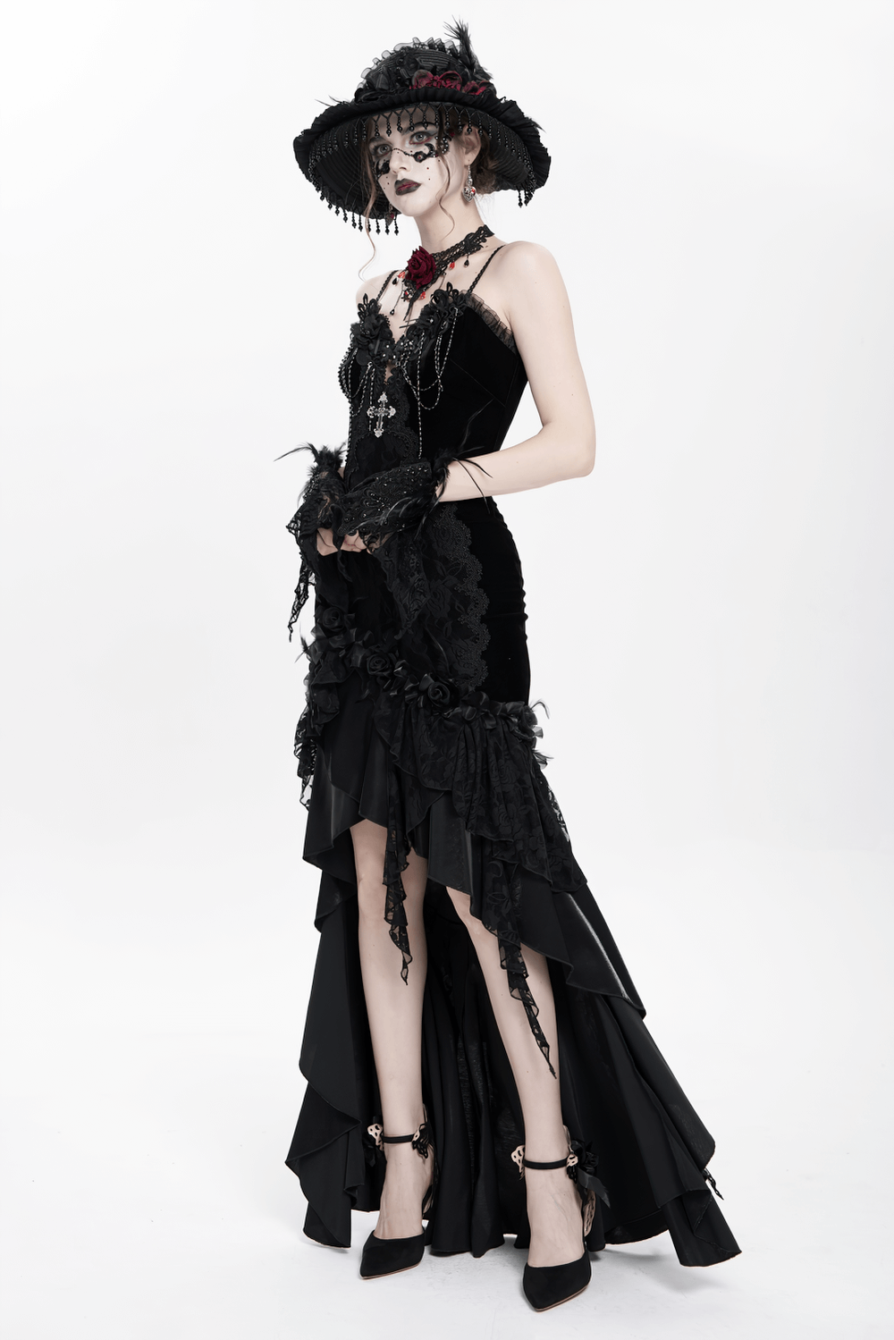 Gothic black velvet and lace high-low evening dress with ruffled hem and rose trim, perfect for elegant occasions.