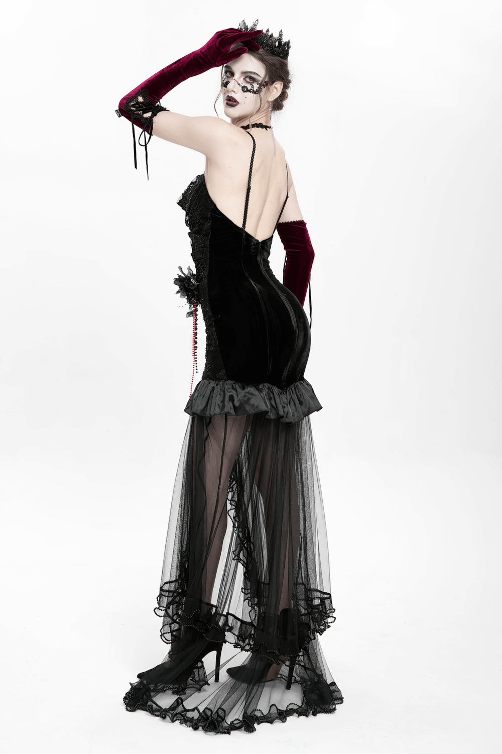 Gothic black velvet and sheer mesh high-low dress with ruffles and beaded details, perfect for evening events.