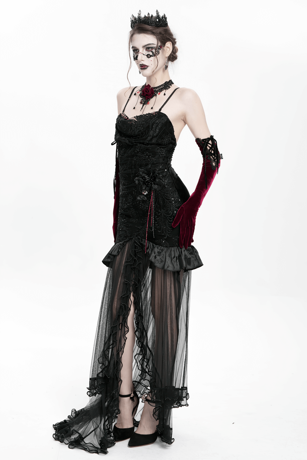 Gothic black velvet and sheer mesh high-low dress with elegant ruffles and beaded details.