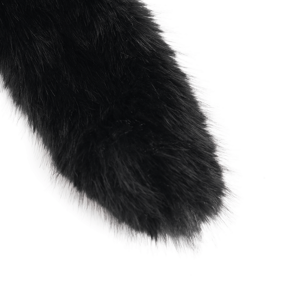 Close-up of a fluffy black fur tail, soft and sleek, perfect for gothic costumes and playful accessories.