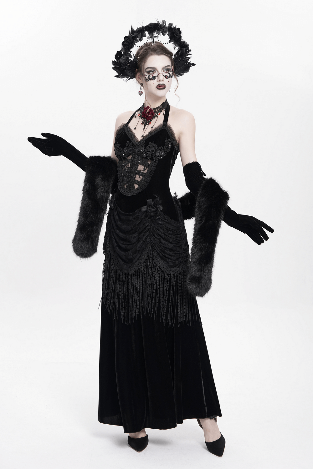 Gothic black velvet dress with lace appliqué and fringe details, styled for Victorian cosplay and dark evening wear.