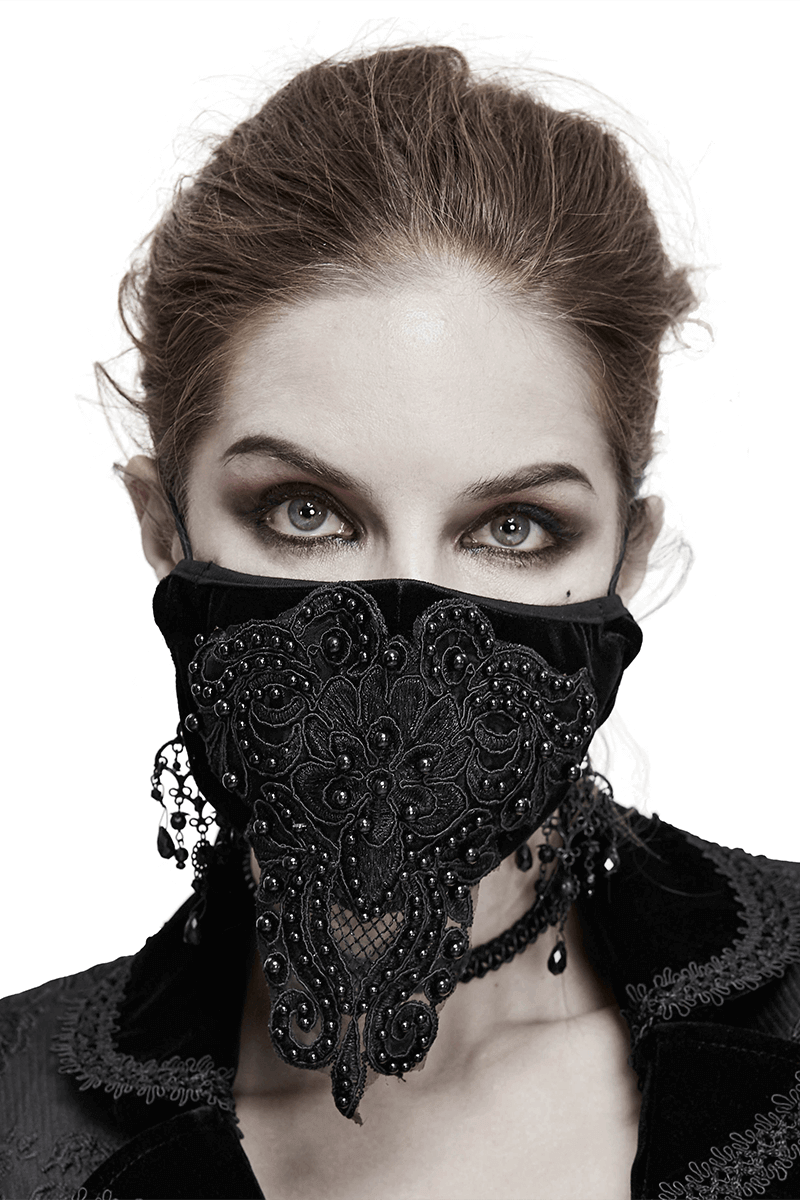 Stylish gothic black velvet face mask for women with lace applique and adjustable straps, elevating any outfit.