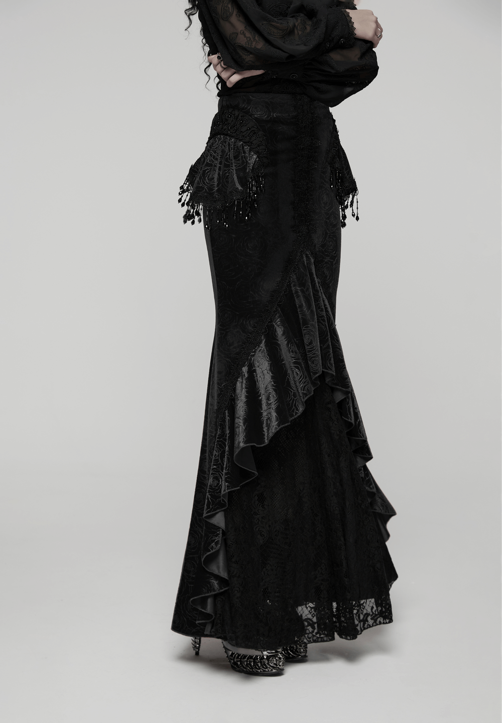 Gothic Black Velvet Fishtail Skirt with Lace Detail featuring tassels and a high-low hem for dramatic flair.