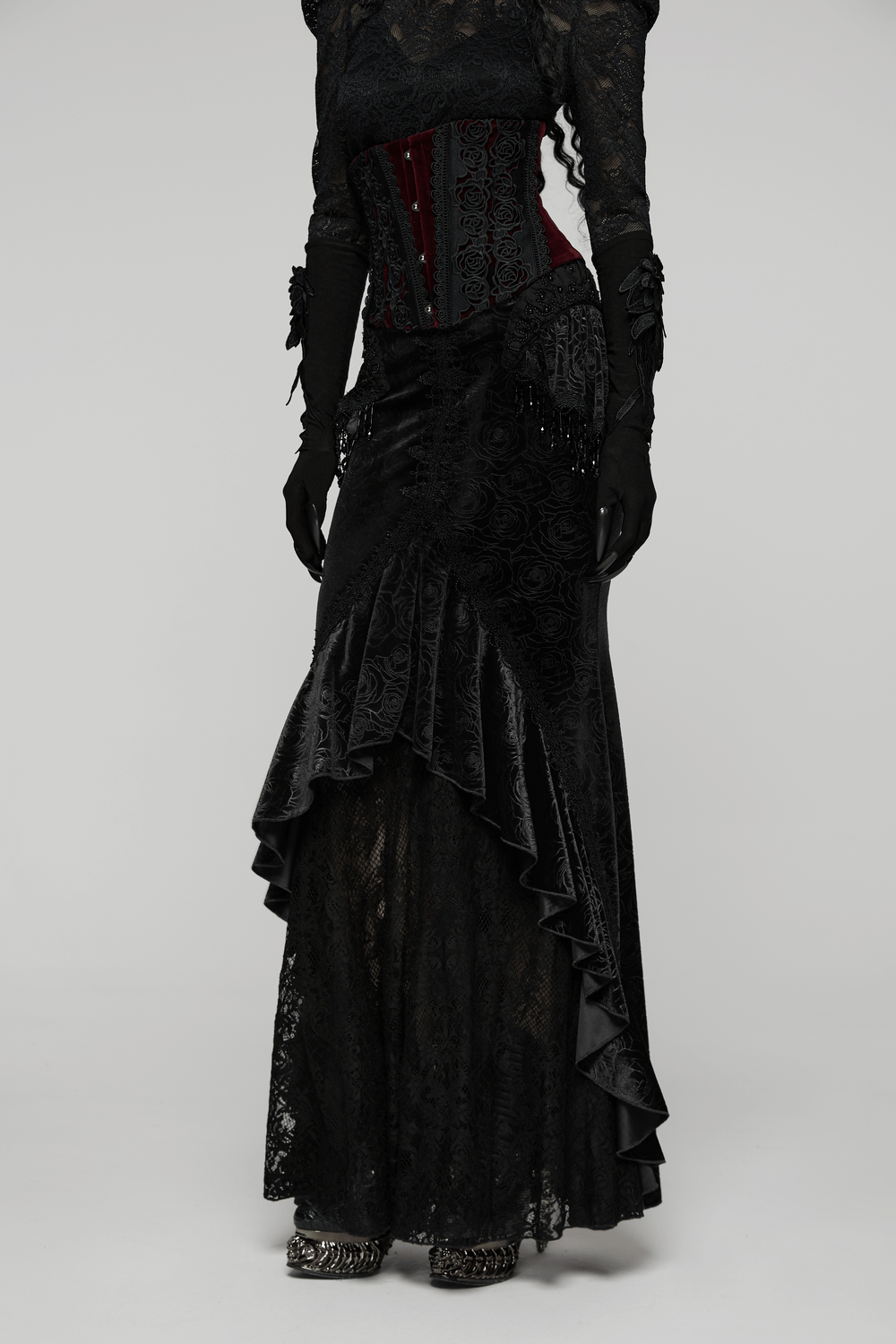 Gothic Black Velvet Fishtail Skirt with Lace Detail showcases elegant lace and tassel accents, creating a dramatic silhouette.