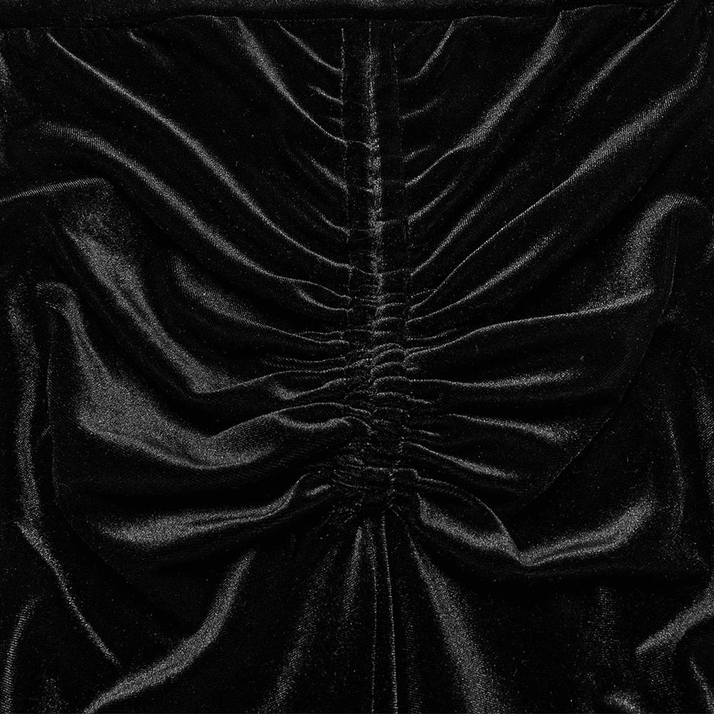 Close-up of ruched black velvet fabric showing texture and shine for gothic flared pants.