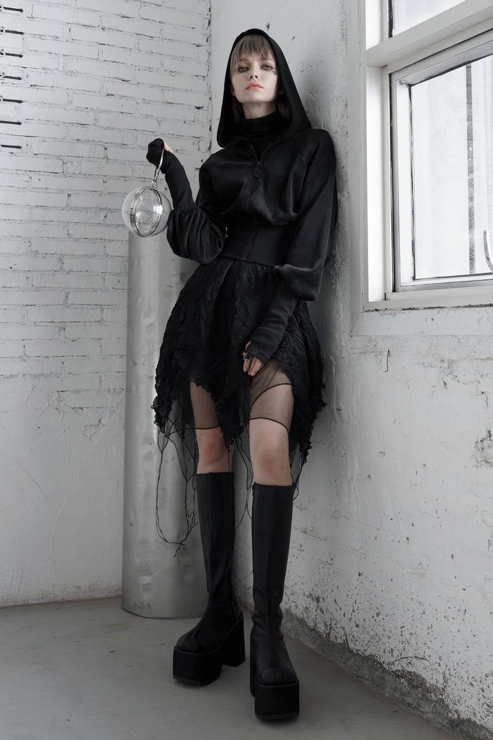Gothic black velvet hoodie with pointed wizard hood and stylish outfit, showcasing edgy fashion details.