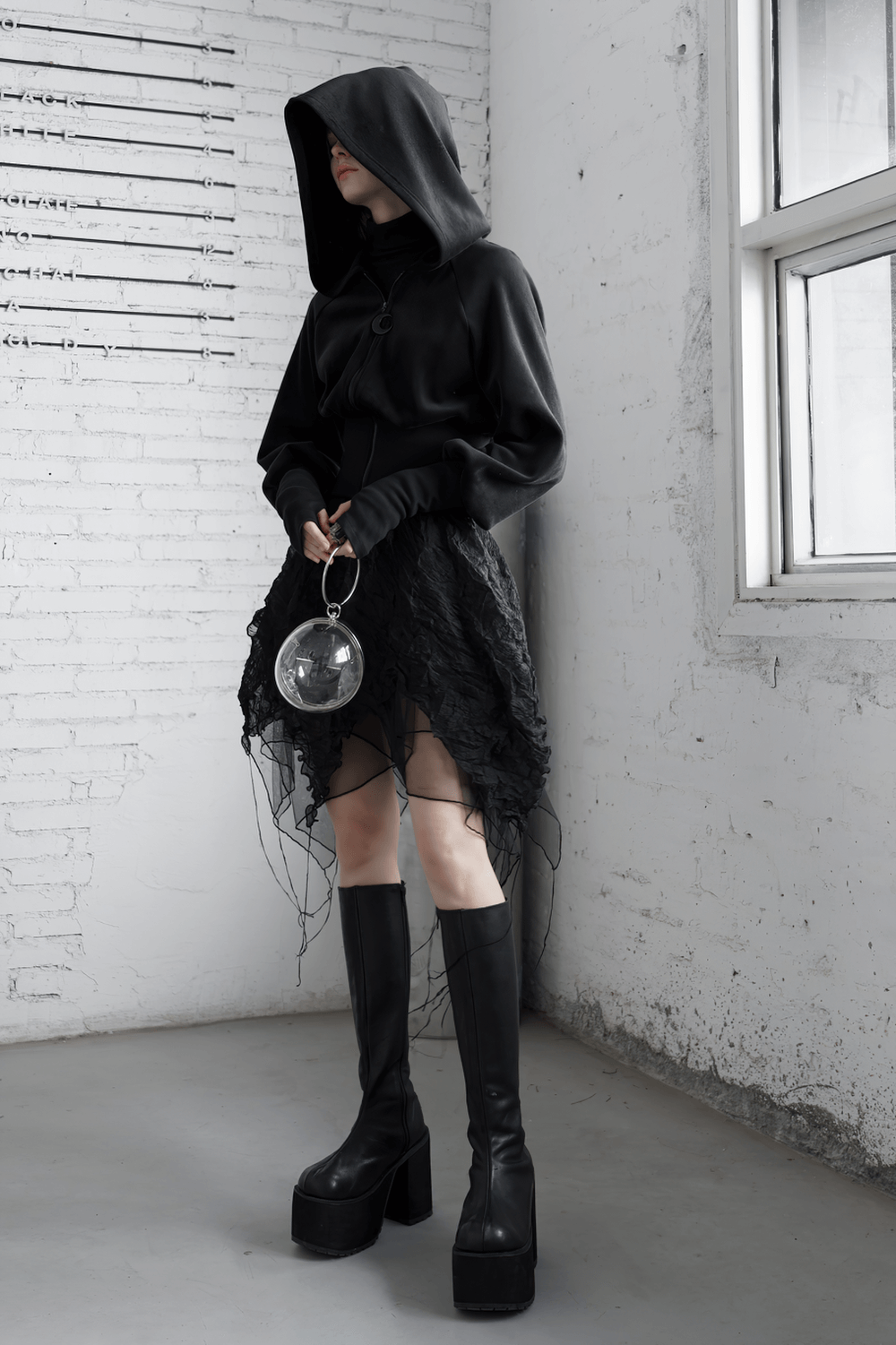 Gothic black velvet hoodie with pointed wizard hood, paired with edgy lace skirt and platform boots.