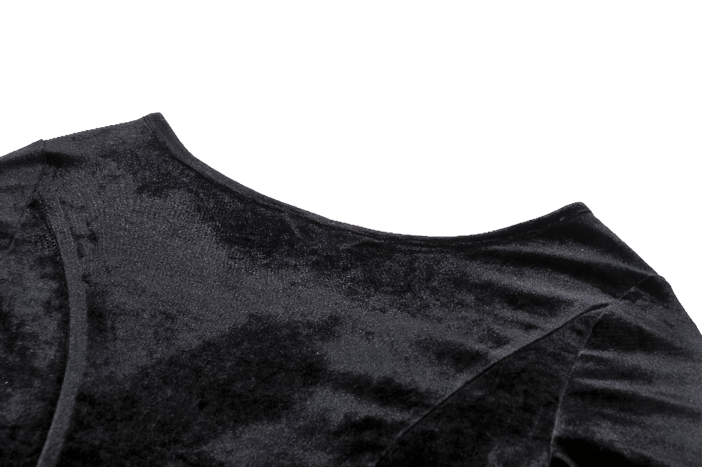 Close-up of the soft black velvet texture on the shoulder of a Gothic lace-up dress.