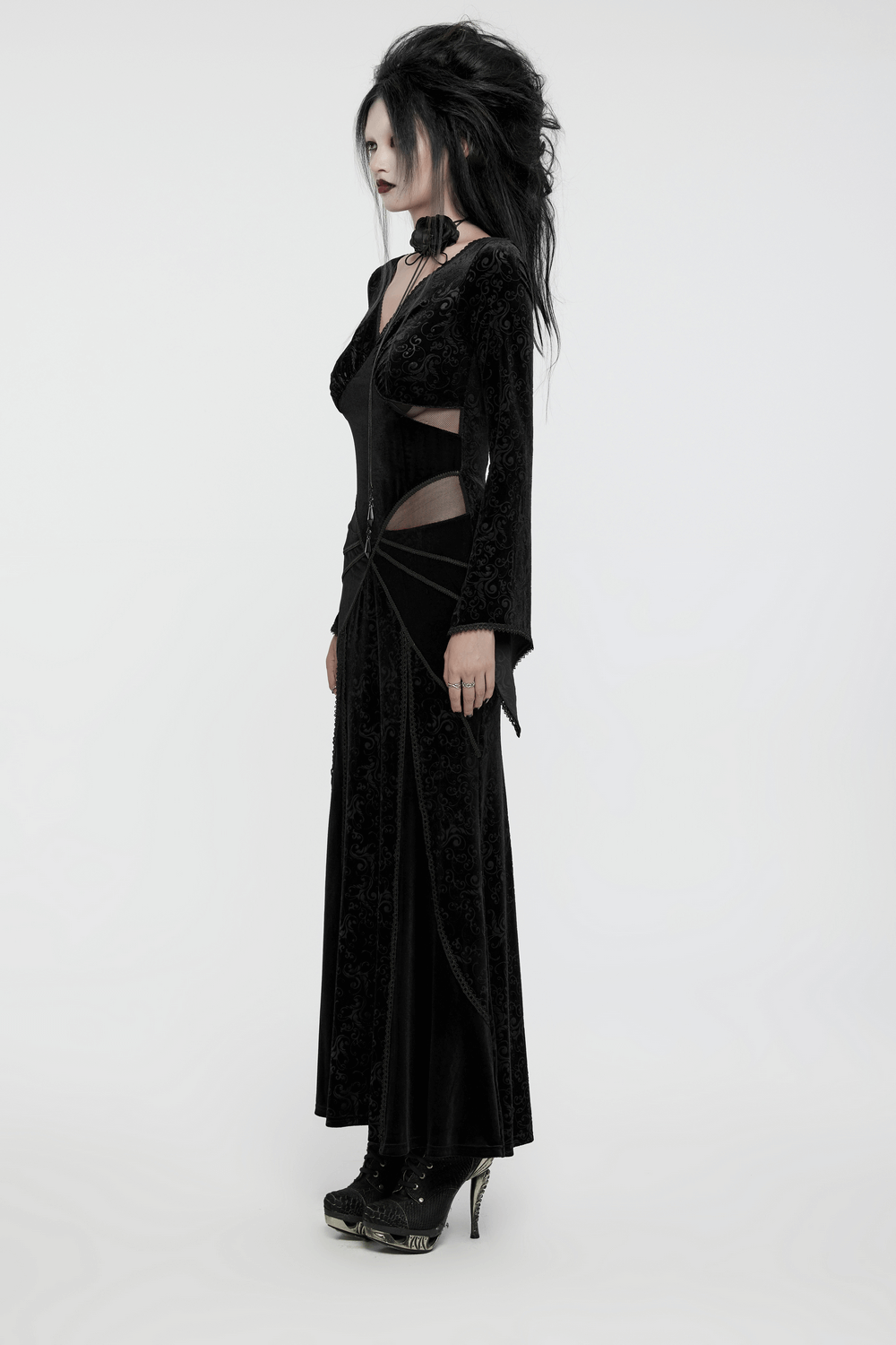 Elegant gothic black velvet long dress with embossed details and mesh splicing, showcasing a striking silhouette.