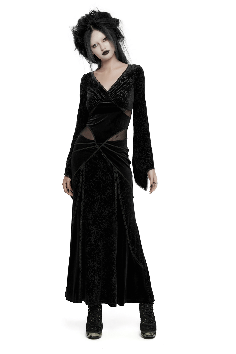 Gothic black velvet long dress with mesh splicing and embossed details, embodying elegance and bold style.