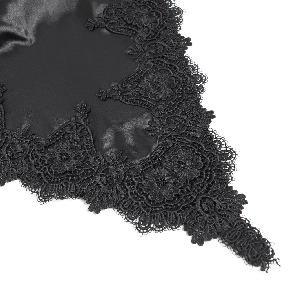 Intricate black lace detailing on a velvet fabric, perfect for gothic fashion and evening wear.