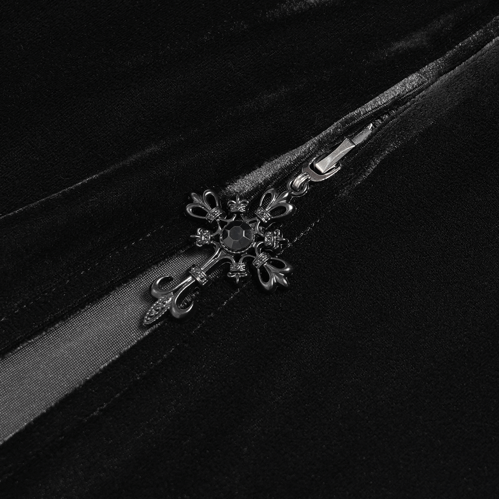 Close-up of the elegant zipper detail on a gothic black velvet dress with intricate lace design.