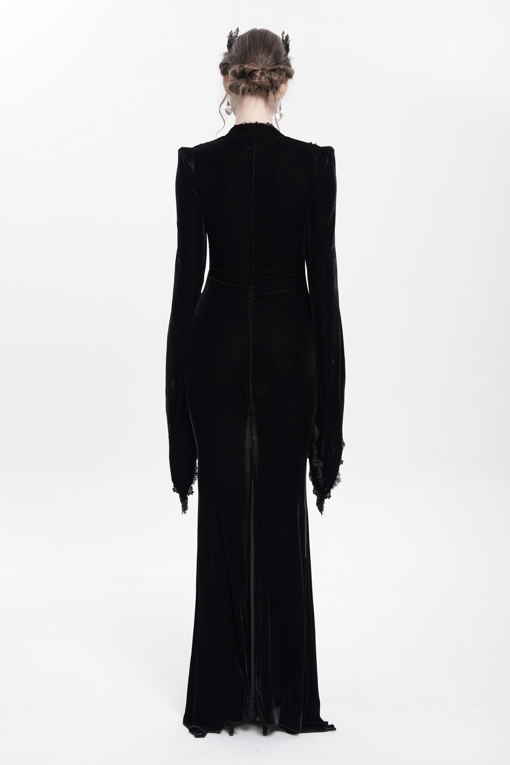 Elegant gothic black velvet long dress with flared sleeves, showcasing a sleek silhouette from the back.