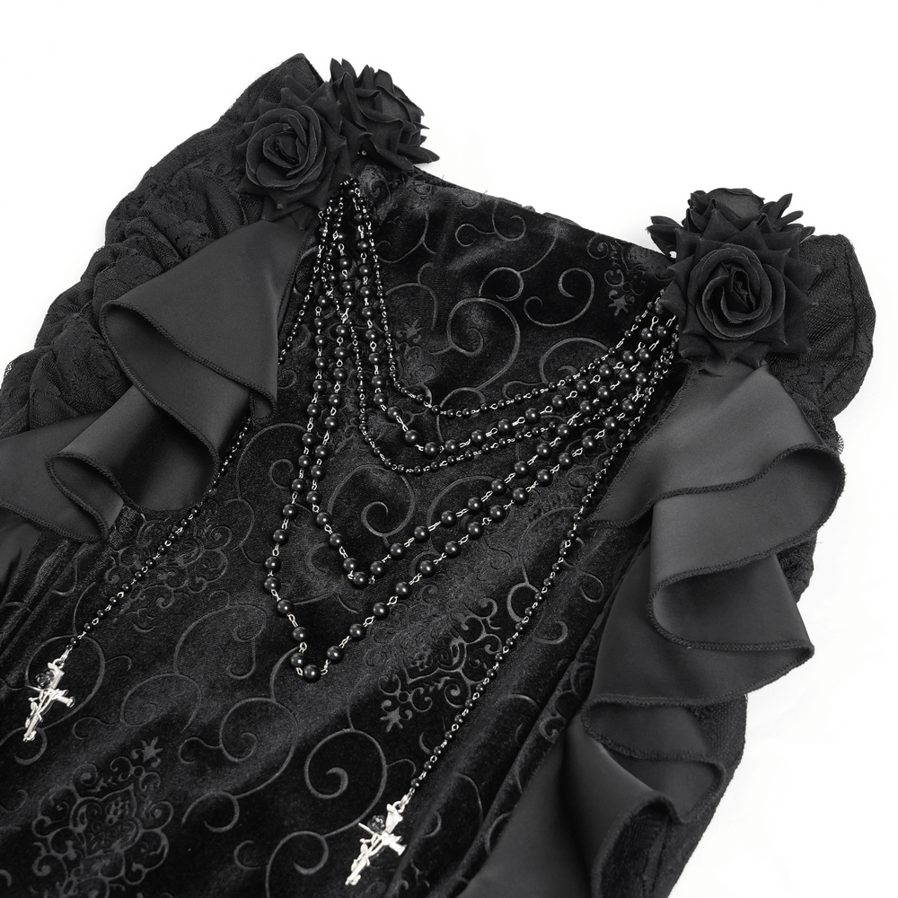 Gothic black velvet maxi skirt adorned with ruffles, floral accents, and chain details featuring cross pendants.
