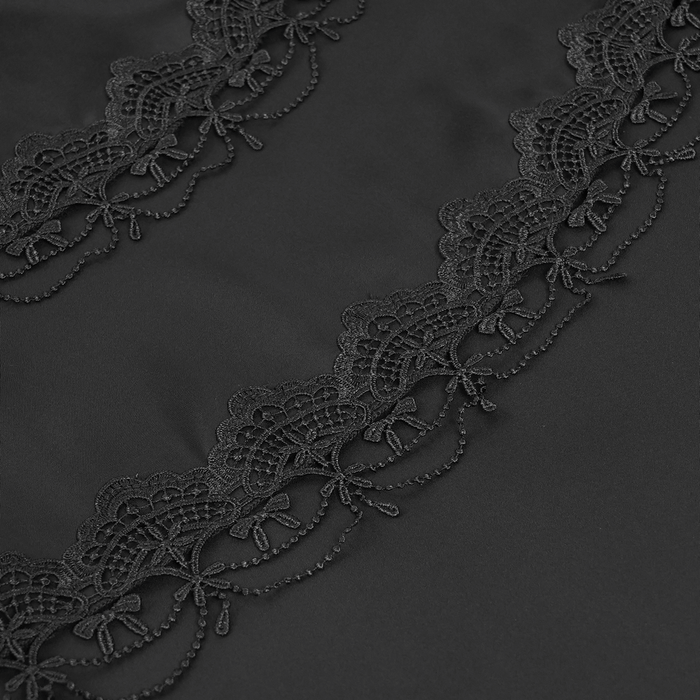 Close-up of elegant black lace trim with intricate patterns, perfect for gothic fashion details.