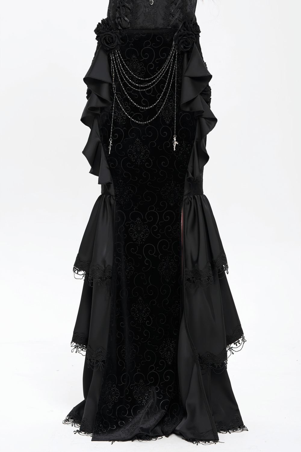 Gothic black velvet maxi skirt with ruffles, chains, and floral accents, perfect for a dramatic gothic look.