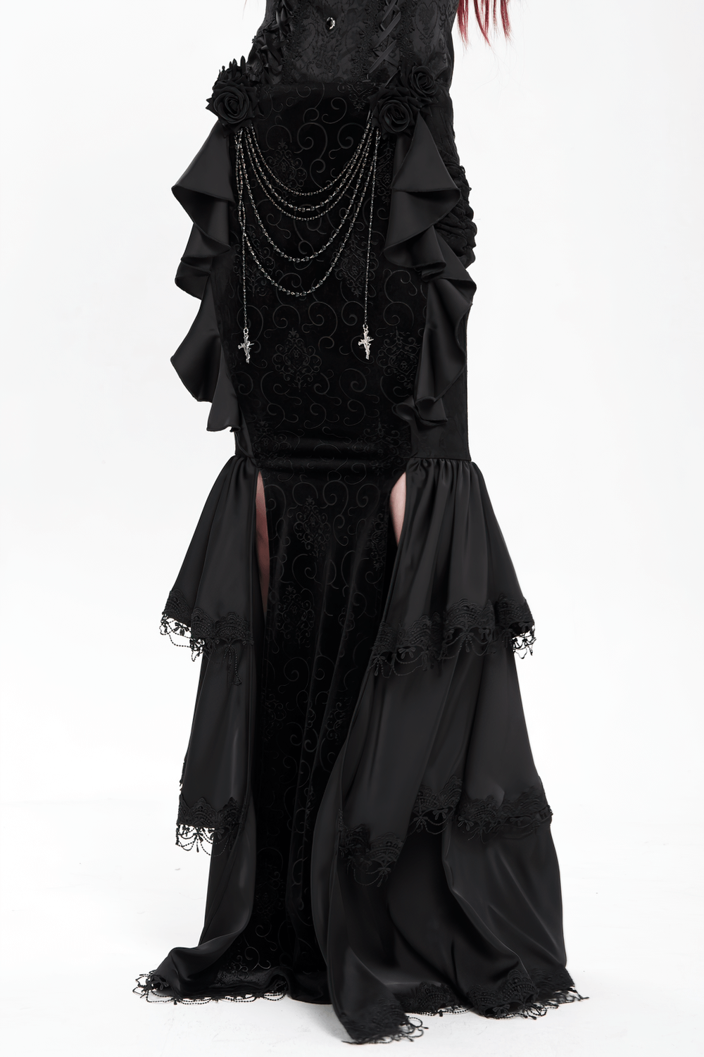 Gothic black velvet maxi skirt with ruffles, chains, and lace details, showcasing an elegant dark silhouette.