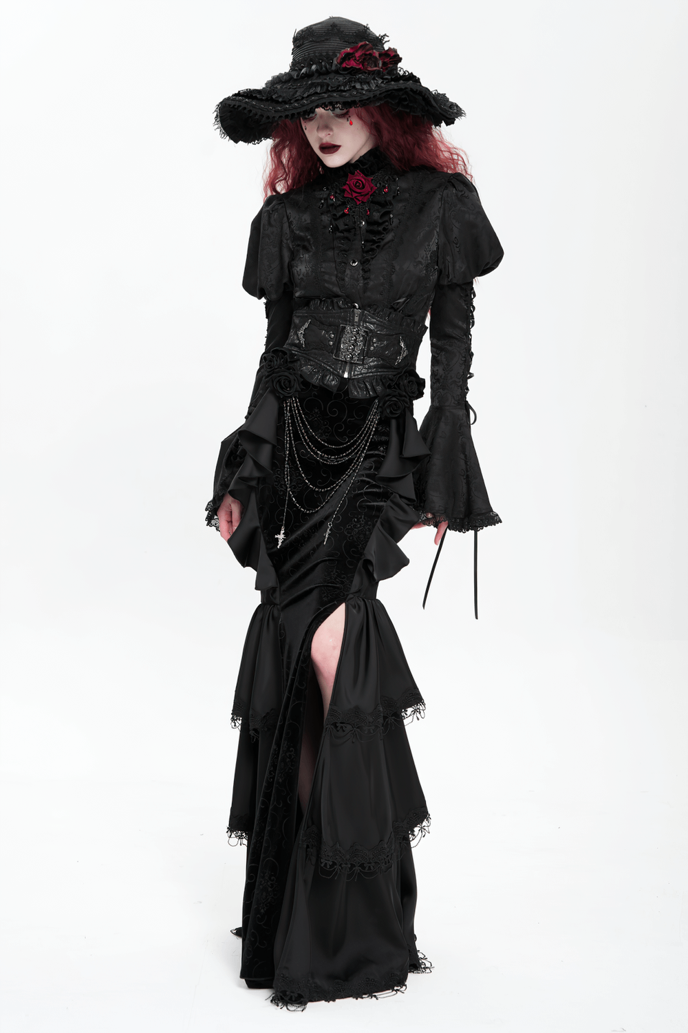 Elegant gothic black velvet maxi skirt with ruffles and chains, paired with a stylish hat and lace top.