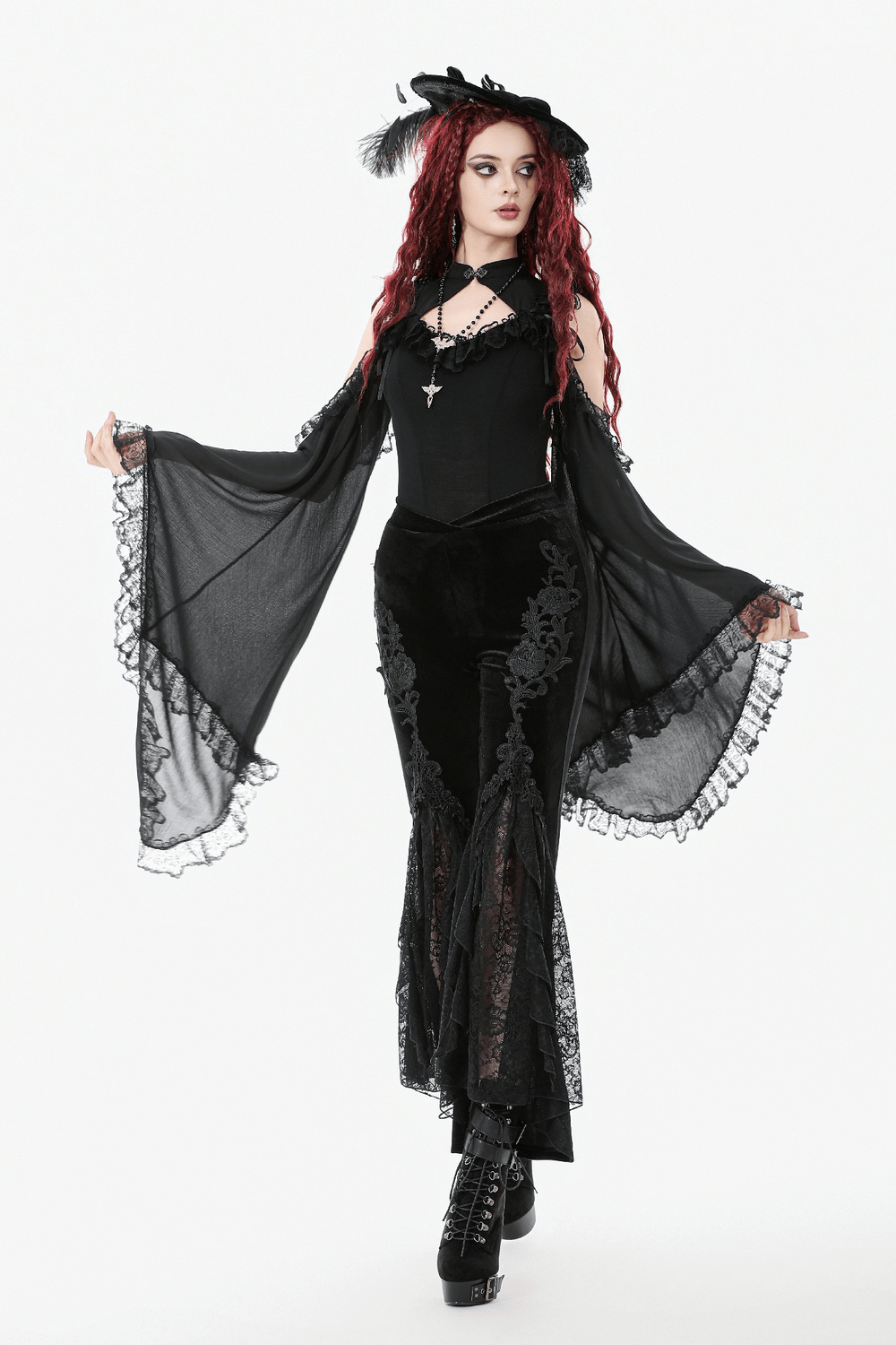 Gothic Black Velvet Pants with Lace Ruffle Panels modeled with dramatic sleeves and a stylish hat.